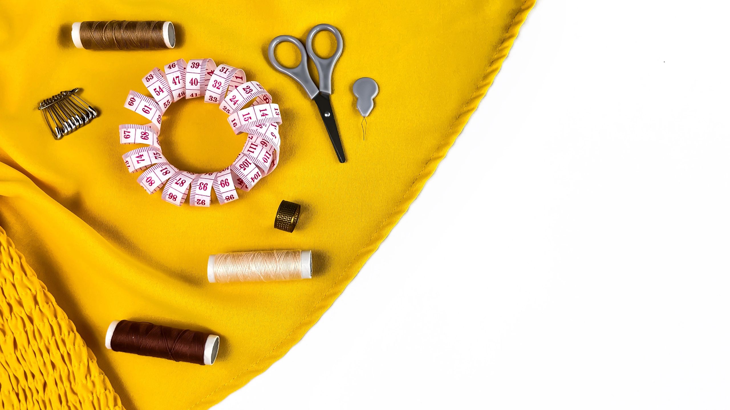 Sewing supplies and fabric representing online orders and checkout terms